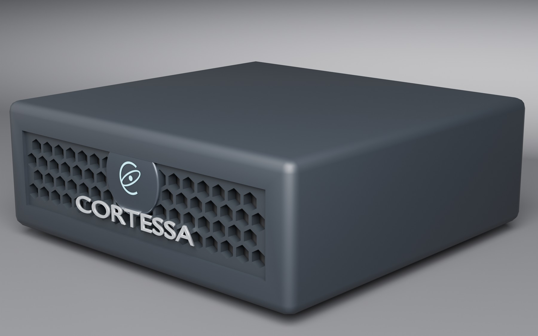 Cortessa appliance concept, front three-quarter view: a low, near-black unit with a honeycomb intake grille, the cyan Cortessa emblem on a machined badge, and the Cortessa wordmark.